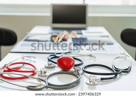 Stethoscope and medical tools on table with laptop in the background medical concept Professionalism and dedication to patient care