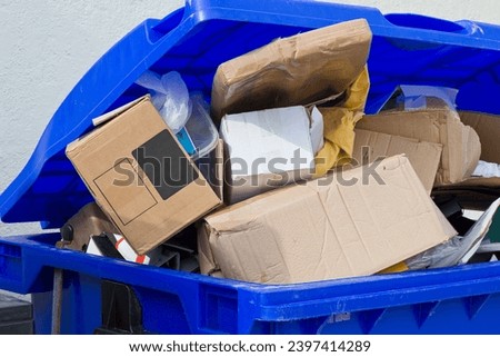 Cardboard boxes collected in a dumpster ready to be recycled - Recovery and recycling material
