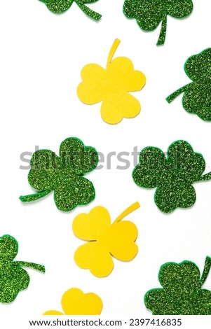 Happy St. Patrick's Day banner.Holiday background.St Patricks Day frame against a white background. Flat lay shamrocks.Copy space.Patrik's day banner Royalty-Free Stock Photo #2397416835