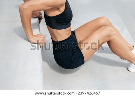 Fit woman doing push ups on the stairs Royalty-Free Stock Photo #2397426467