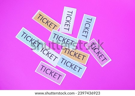 Tickets, paper cards on  pink background. Concept, tickets for passing or enter to join activity or public vehicles. Tickets for playing games. Teaching aids.                                          