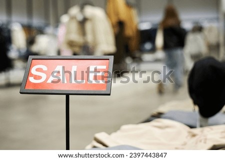 Closeup of sale sign at clothing shop