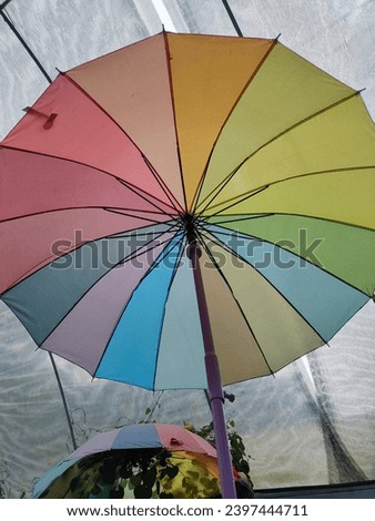 a closed up colours umbrella selected 