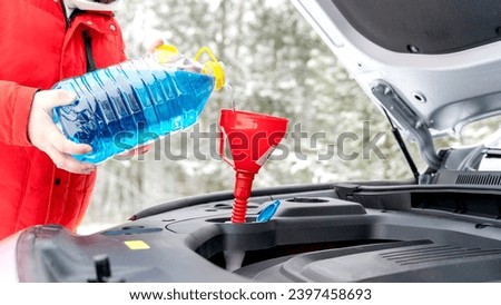 Winter windshield wiper for car. High quality photo Royalty-Free Stock Photo #2397458693