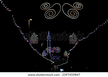 view from the road of the blackpool tower and illuminations at night time Royalty-Free Stock Photo #2397459847