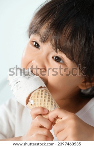 Lovely boy eating ice cream