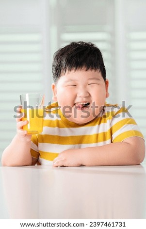 Lovely fat boy drink juice