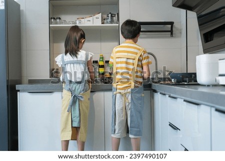 Happy children do housework at home