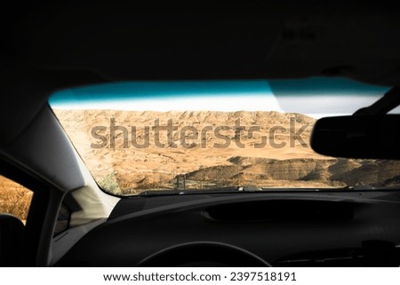 Travel photography. Beautiful landscape from the car window. Harmonious colors. Canyon and hills. The landscape is like on Mars. Countryside.