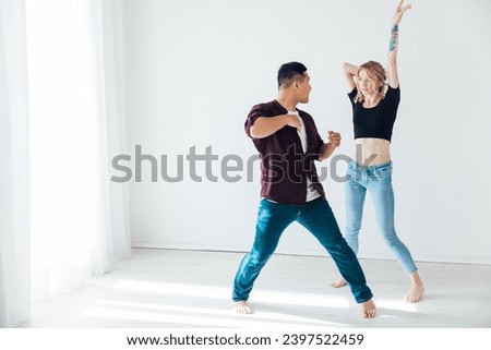Man and woman dancing to bachata music