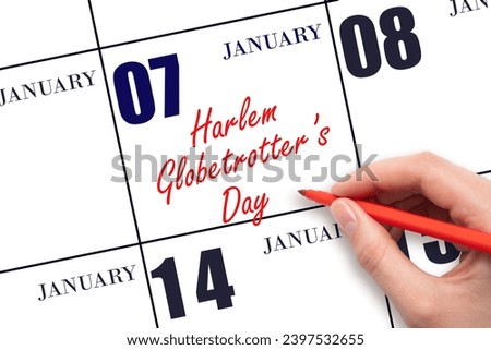 January 7. Hand writing text Harlem Globetrotter's Day on calendar date. Save the date. Holiday. Day of the year concept.