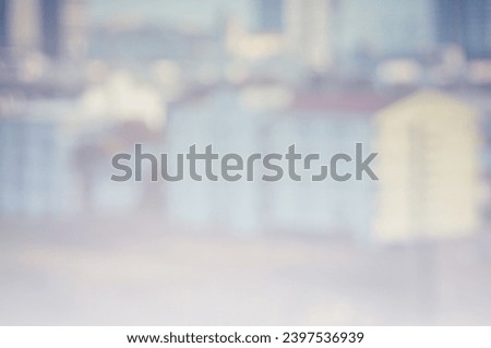 Blurred image of metropolis, homes, buildings, apartments and bokeh from lens melting for wallpaper, backdrop and design.