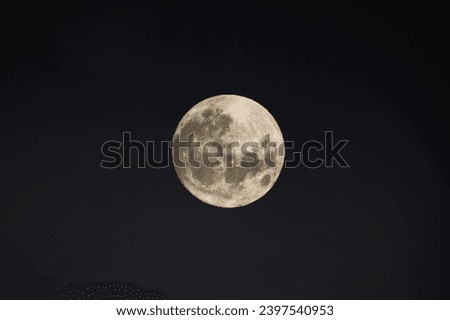 Full moon close up photo. Close up of full Luna. Detail of moon surface. Isolated background. Full moon closeup showing the details of the lunar surface. The Moon isolated on a black. Explorer space
