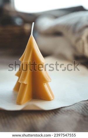 Beeswax Christmas tree candle, cozy photo.