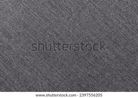 Texture of black carbon fabric. Textile. Background of dark fabric for tailoring