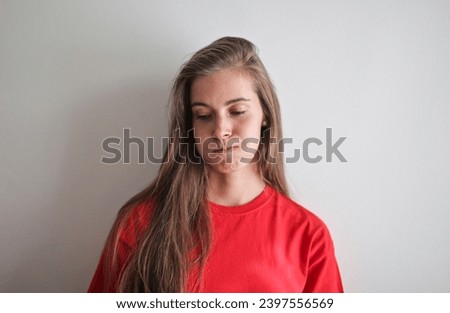 portrait of a saddened young woman Royalty-Free Stock Photo #2397556569