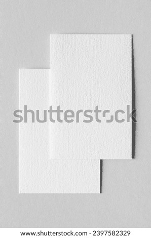 Textured business card mockup, vertical orientation. 55x85 mm.