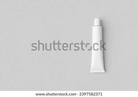 White metal cream tube mockup. with blank copyspace. Royalty-Free Stock Photo #2397582371