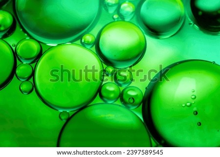 Green drops of oil or serum texture background. Abstract green fluid with bubbles	
 Royalty-Free Stock Photo #2397589545