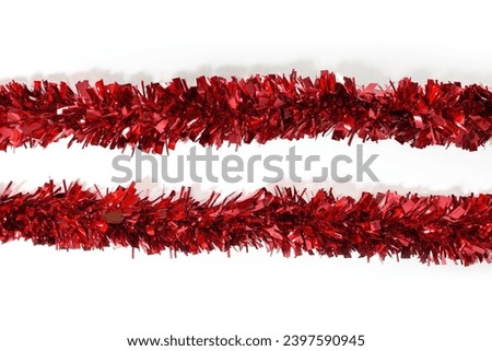 Two red Tinsel Decorations Garland for Xmas Tree, Christmas Tinsel Decorations for Wall Windows Wreath Stairs Bannister Fillable Baubles Ceiling Party Decorations, white background, isolated. Royalty-Free Stock Photo #2397590945