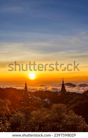 Landscape of two pagoda (noppha methanidon-noppha phon phum siri stupa) 
in sunrise time with mist in the backgroundat at Inthanon mountain, chiang mai, Thailand Royalty-Free Stock Photo #2397598029