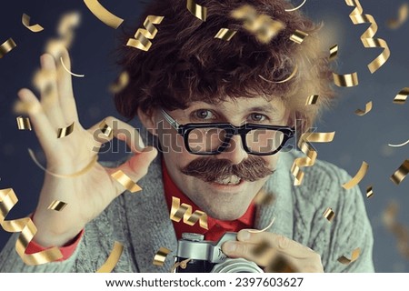 man portrait greeting new year and christmas falling flying confetti