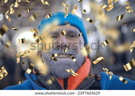 man portrait greeting new year and christmas falling flying confetti
