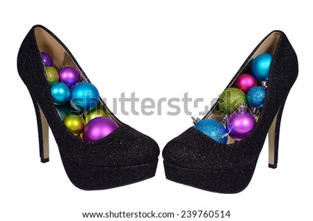Black female shoes with Christmas colored balls on a white background