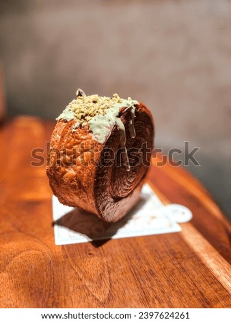 Cinnamon Roll with Pistachio Cream and Crumble Topping