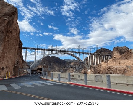 Photo of Mike O'Callaghan-Pat Tillman Memorial Bridge, an arch bridge that spans Colorado River between Arizona and Nevada located within the Lake Mead National Recreation Area in the United States. Royalty-Free Stock Photo #2397626375