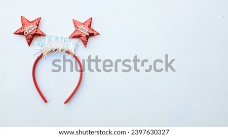 decorated Beautiful headband funny red star isolate on a white backdrop.
concept of joyful Christmas party,New year is coming soon, festive season decoration with Christmas elements