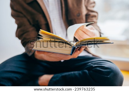man reading a book Royalty-Free Stock Photo #239763235