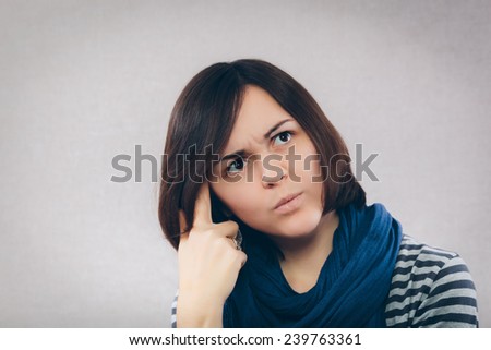 A young pensive girl looking up