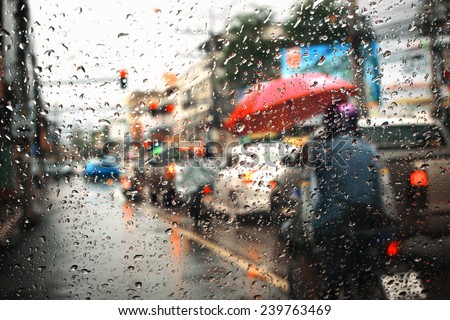 Morning traffic ,view through the window on rainy day Royalty-Free Stock Photo #239763469