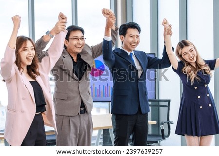Asian professional successful two male businessmen partnership dealer and customer in formal business suit standing posing with female secretaries in company office meeting room