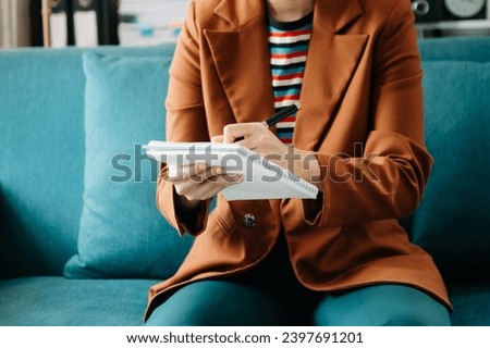 businesswoman hand writing on the notepad with new modern computer strategy diagram as concept morning light
 Royalty-Free Stock Photo #2397691201
