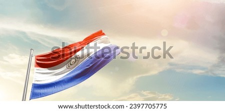 Paraguay national flag waving in beautiful sky. The flag waving with dynamic angle. Royalty-Free Stock Photo #2397705775