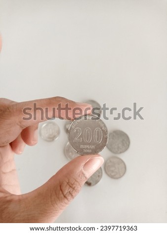  Indonesian coins with a value of one hundred rupiah on a white