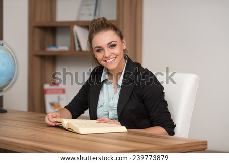 A Portrait Of An Caucasian College Student Woman In Library - Shallow Depth Of Field