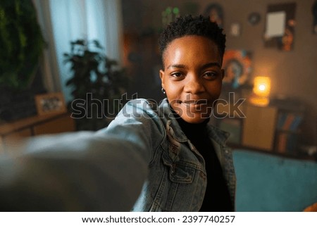 Portrait of dark skinned afro american with short haircut having video call with friends family taling happy family concept.