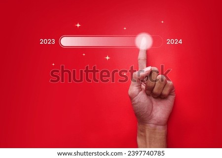 Hand with progress bar with New Year's Eve Download. Loading animation screens with sparkling star performances almost reaches 2024. Royalty-Free Stock Photo #2397740785