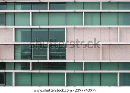 Building facade with window pattern Royalty-Free Stock Photo #2397740979