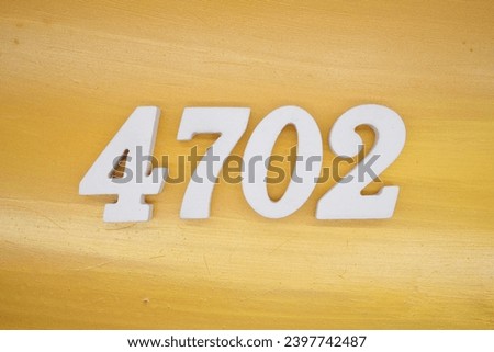 The golden yellow painted wood panel for the background, number 4702, is made from white painted wood.