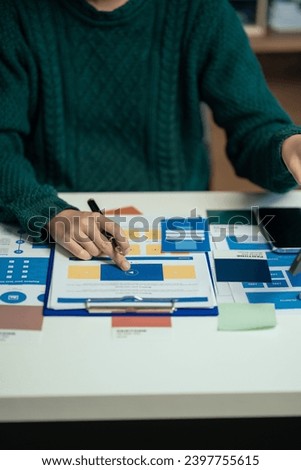 Creative male web designer planning application development for web mobile phone at modern workplace.