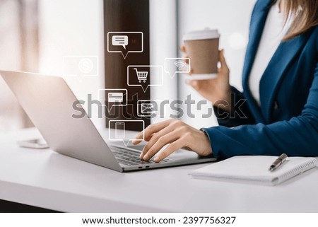 Social media icons screen of businessman with smartphone and laptop computer at office at morning light.