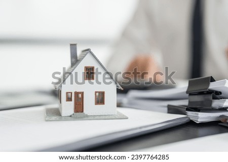 Business people signing contract making deal with real estate agent Concept for consultant home insurance
Real estate investment Property insurance security. Real estate agent.