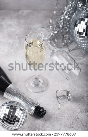 Glass of champagne with disco ball.