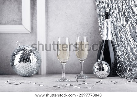 Glass of champagne with disco ball.