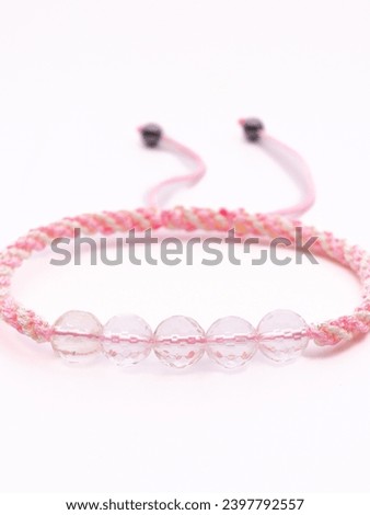 Woman hand with bracelets show thumb up symbol isolated on white background ,clipping path included for design.