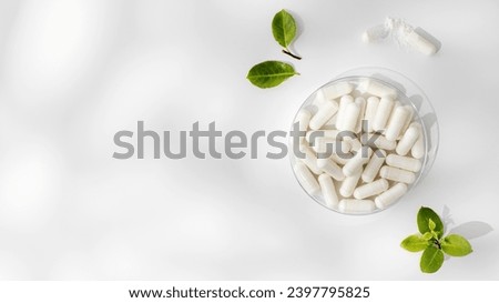 White capsules with minerals or food additives with an organic composition. Vitamins. Copy space